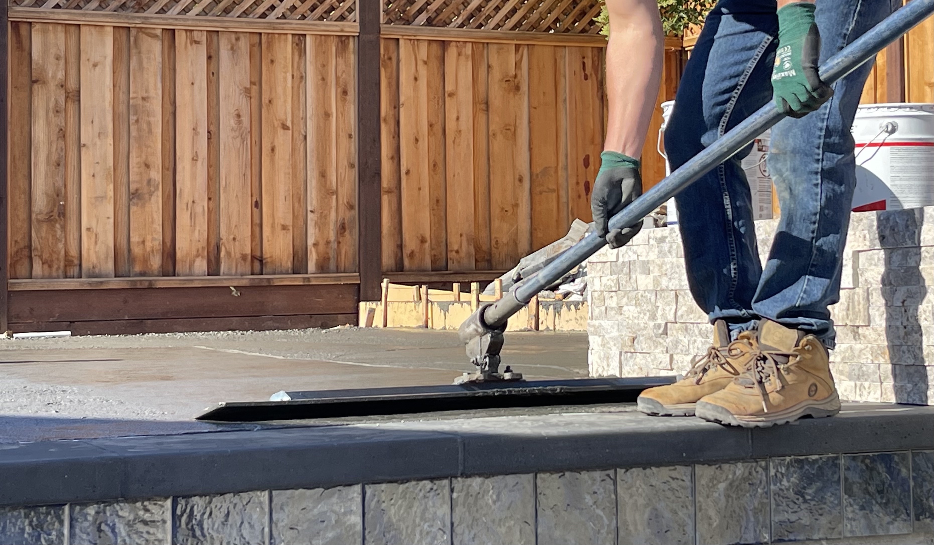 Finishing concrete on pool deck in Livermore, CA.